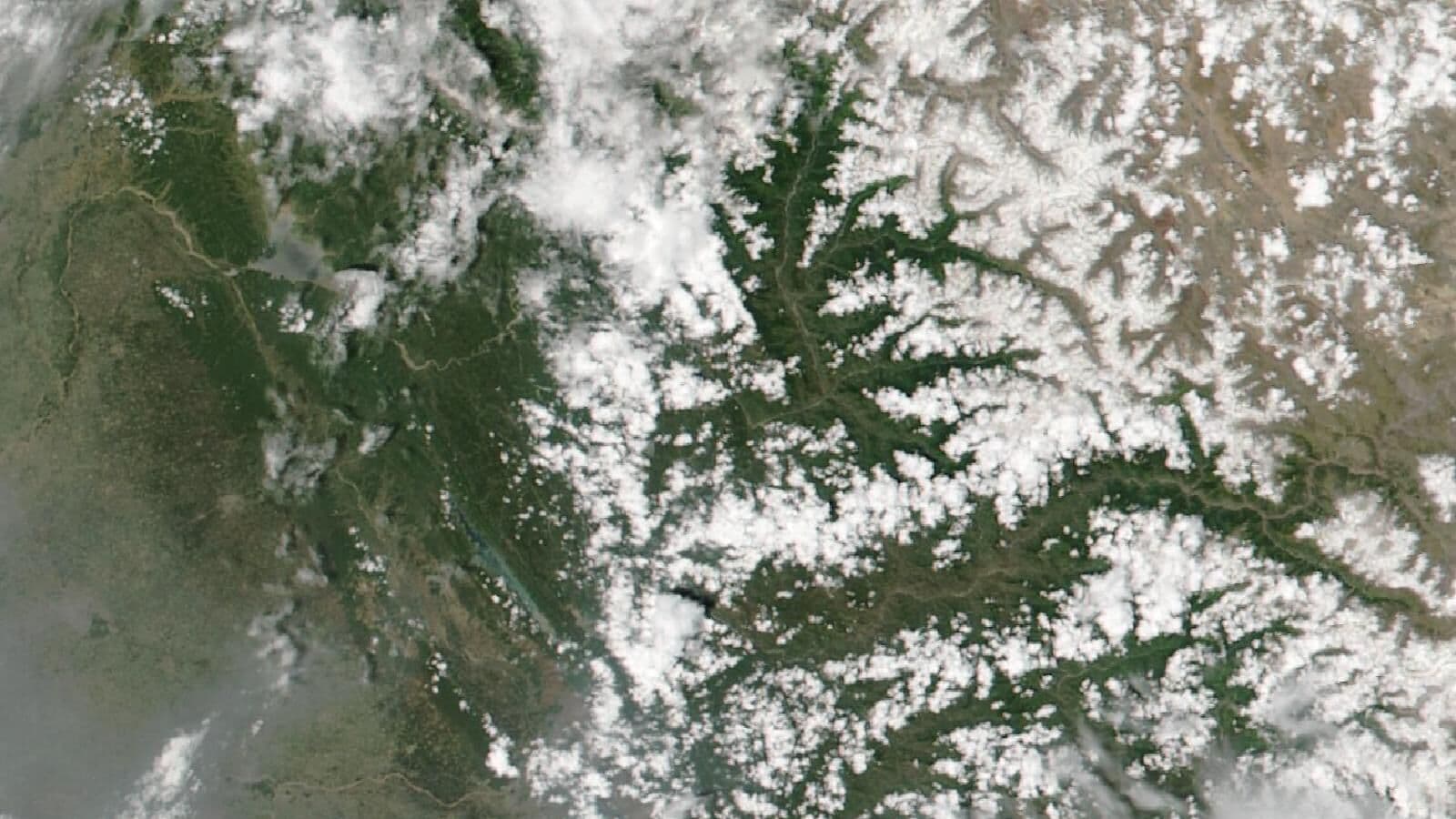 Satellite view of monsoon clouds over the mountain valleys of Himachal Pradesh
